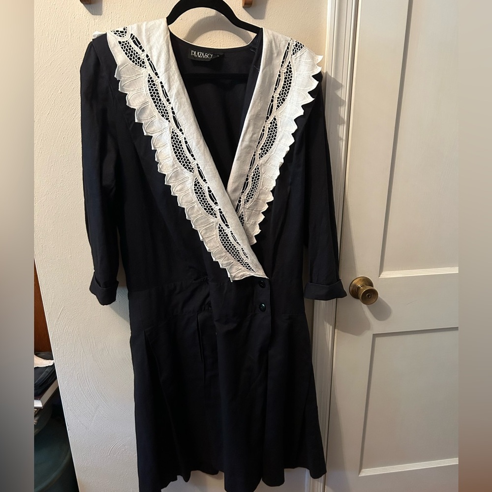 Vintage but like new Black dress-with wide white lace collar, deep V neckline.